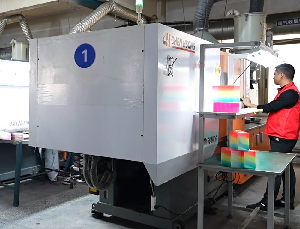 Chen Hsong injection moulding machine producing colourful card holder parts
